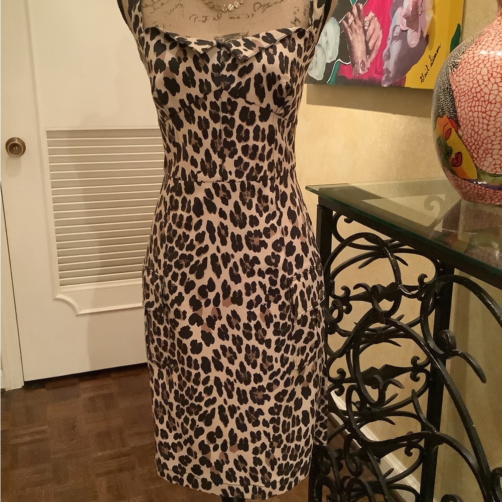 Fitted animal print dress with cargo pockets.